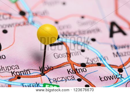 Photo of pinned Kolo on a map of Poland. May be used as illustration for traveling theme.