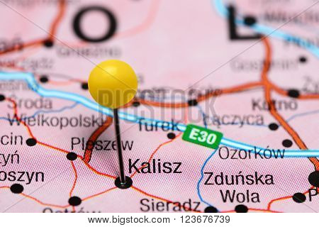 Photo of pinned Kalisz on a map of Poland. May be used as illustration for traveling theme.