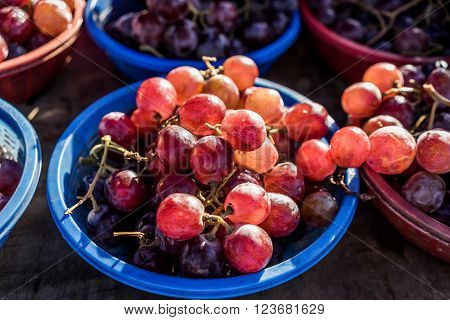 A shot of fresh grapes in mini baskets taken at a local street market in Benut Johor Malaysia.