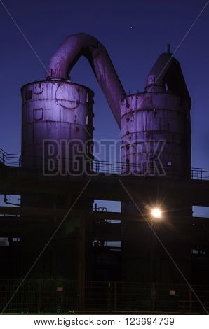 Duisburg, Germany - May 18, 2015: Nocturnal shot of Landschaftspark Nord illuminated industrial plant in Duisburg Germany. Landschaftspark is a public park located in Duisburg-Meiderich, Germany.
