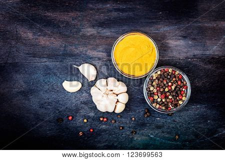 Aromatic spices on wooden background. Food ingradients.