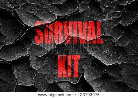 Grunge cracked Survival kit sign with some soft flowing lines