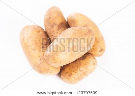 some ripe raw potatoes isolated on white in studio