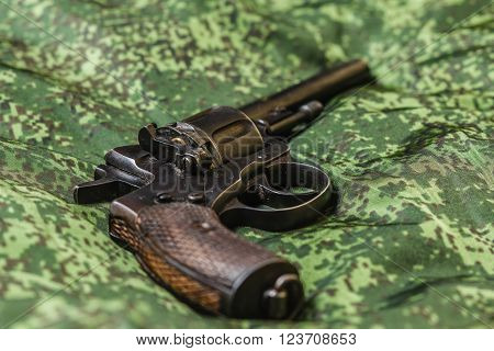 Vintage generic russian soviet 9mm pistol on pixel camouflage background