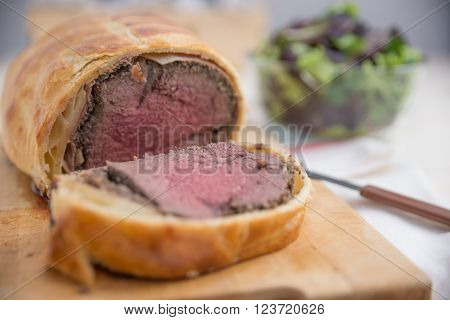 Slices of Beef Wellington on the serving dish
** Note: Shallow depth of field