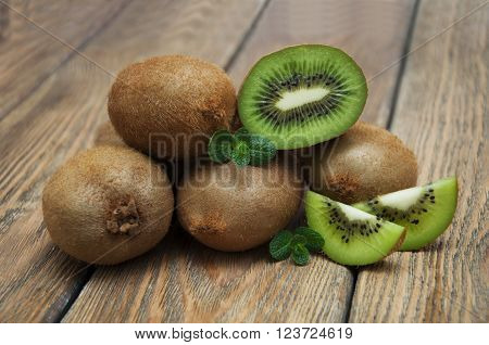 Fresh juicy ripe kiwi on a wooden background