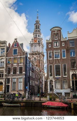 AMSTERDAM HOLLAND - JANUARY 1: View from the canal on the historic tower in Amsterdam on 1 january 2013