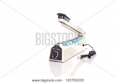Close up plastic bag sealer isolated on white background