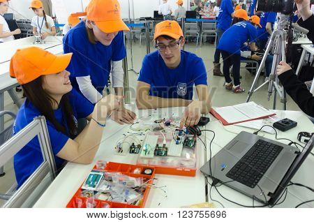 Tyumen, Russia - March 23. 2016: Open championship of professional skill among youth. World skills Russia Tyumen - 2016. Students of the Tyumen teacher training college show electronic components