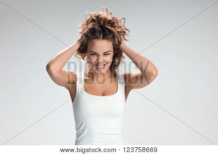 The portrait of violent and militant woman on gray