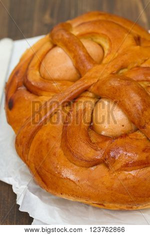 portuguese traditional Easter cake Folar on brown wooden background