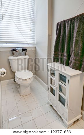 simple guest half bathroom with white tile