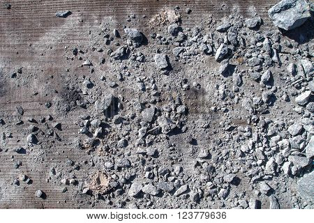 Broken stones on grit surface. Grunge concrete texture. Distressed background. Retro texture. Vintage texture