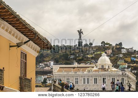 QUITO ECUADOR OCTOBER - 2015 -Low angle view of colonial classic style buildings and the famous panecillo hill at background at the historic center of Quito in Ecuador.