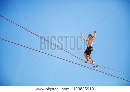 Highline walker participating in competition at extreme sports festival on August 24, 2015 in Karolino-Bugaz, Ukraine.