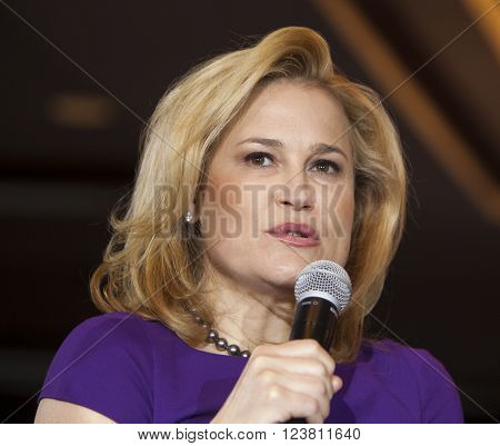 MADISON WI/USA - March 28 2016: Heidi Cruz the wife of Republican presidential hopeful Ted Cruz speaks to a group of supporters during a rally in Madison Wisconsin.