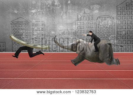 Man with pointing finger gesture riding elephant and running after money with human legs on red running track with doodles concrete wall background.