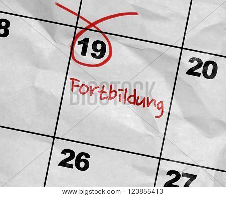 Concept image of a Calendar with the text: Further Education (in German)