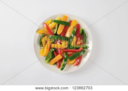 Plate of three color bell pepper strips