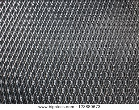 Shiny galvanised industrial steel grid for use as background.