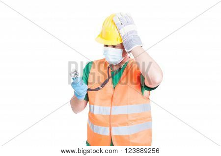 Confused doctor or medic wearing builder clothes as vest and helmet