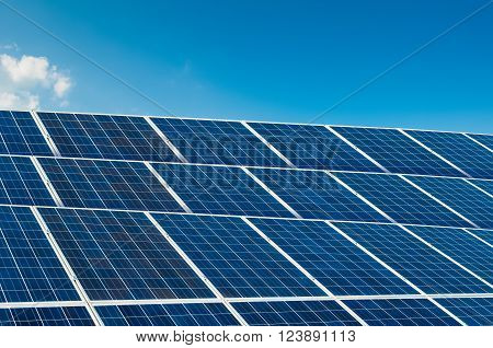 Solar panels on blue sky with copy space and text area