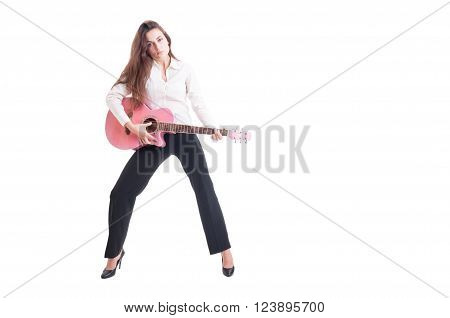 Young business woman with long hair playing pink quitar. Elegant female quitarist isolated on white background