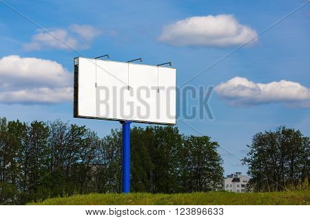 Blank billboard on blue sky background. Blank street poster. For design presentations and portfolios. Shallow depth of field. Selective focus.