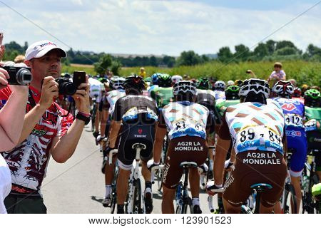 PAMPISFORD, CAMBRIDGESHIRE, UK - JULY 7 2014
Tour de France 2014 Stage 3 (Cambridge to London) with spectators taking photos of peloton