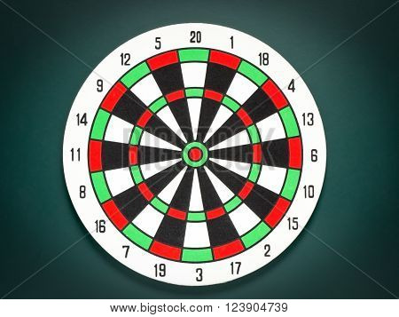 Classic dart target board. Colorful of dartboard on black background.