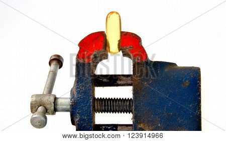 Omega 3 pill compressed by vise tool
** Note: Shallow depth of field
