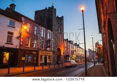 Main street of Cashel Ireland at night with bars and restaurants. Town hotel located in the old historical tower of the popular touristic city in Tipperary