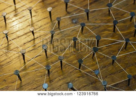 Rustic Nails In Wood Linked By Cotton
