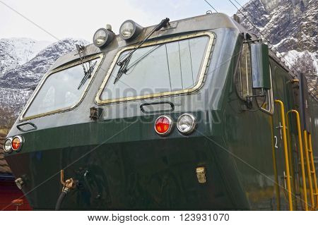 Flam valley, Norway - May 05 2013: a green train at famous Flam railway (Flamsbana) line