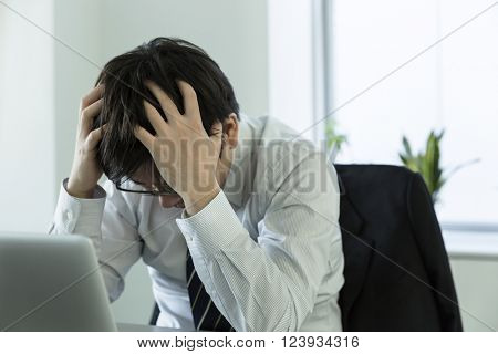 The businessman who is at the wits end, and grieves