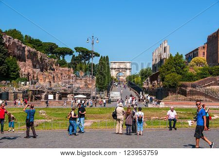 ROME ITALY - JUNE 6: The square of the Colosseum in Rome. View of the arch of Titus on 6 june 2012