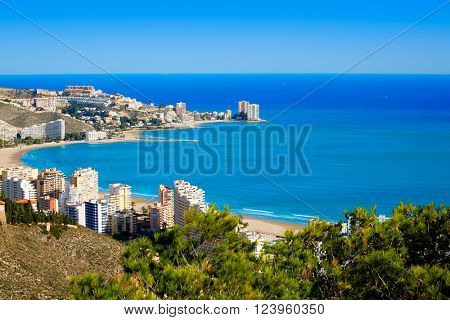 Cullera beach aerial with skyline of village in Mediterranean Valencia of Spain
