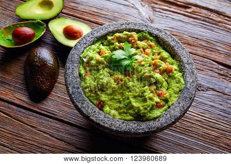 avocado Guacamole on molcajete real Mexican traditional procedure