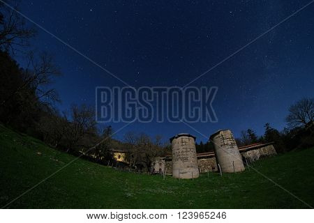 starry night on two silos of Mount Colla old homestead in Nebrodi Park, Sicily
