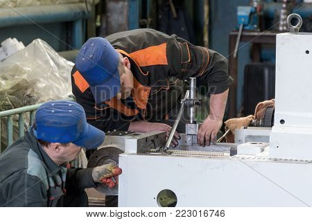 LIPETSK, RUSSIA - JUNE 15, 2017: Lipetsk Machine Tool Plant. Locksmiths are working on assembling a new metal-cutting machine.