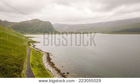 A drone view over Loch Eriboll in the north of the Scottish Highlands on a grey and overcast day.