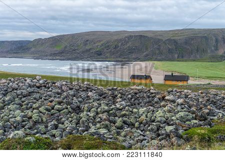 Rocky Cliffs On The Coast Of The Barents Sea Along The Varanger