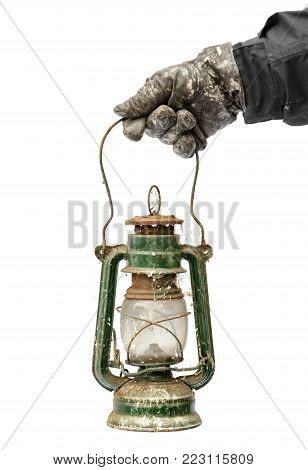 Hand Holding Vintage Dirty Oil Lantern Isolated On White Background.
