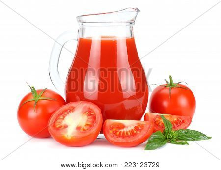 Tomato juice in glass jug isolated on white background