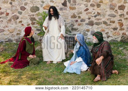 Jesus preaching to a group of people - historical reenactment 