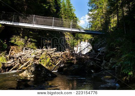 Footbridge on alpine trail through Hell gorge, Schladming, Austria