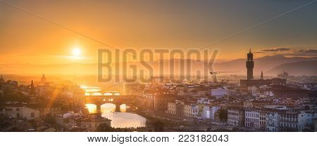 Panoramic view of Arno River, Ponte Vecchio and Palace, Basilica of Santa Croce, Boboli and Bardini gardens at sunset Florence, Italy