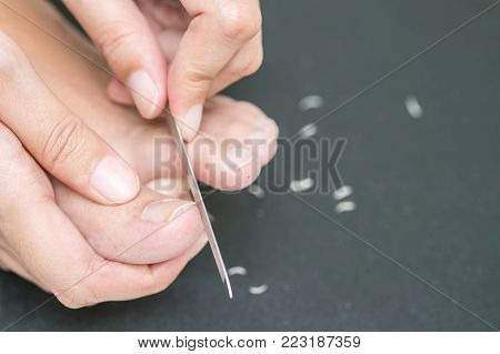 Woman using a nail file for nail care
