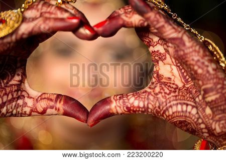 Indian Bride make Heart Shape by her hand