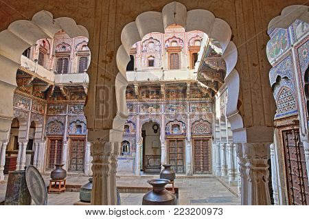 DUNDLOD, RAJASTHAN, INDIA - DECEMBER 27, 2017: Seth Arjundas Goenka Haveli Museum with colorful frescoes and paintings